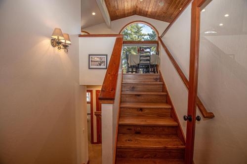 a stairway leading to a home with wooden floors at Tahoe Haven By Hauserman Rentals in Carnelian Bay