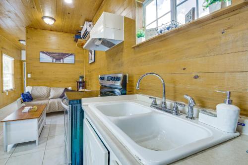 a kitchen with a large white sink in a room at 2 Mi to Family Attractions Brownsville Cottage! in Brownsville