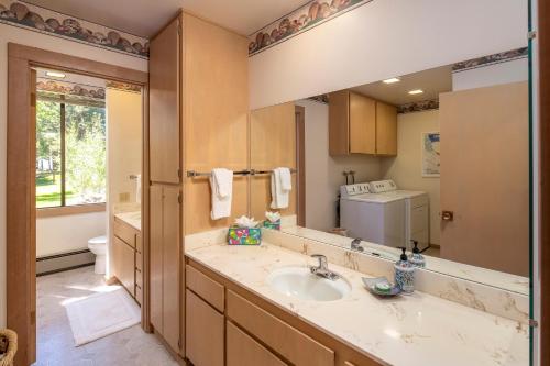 a bathroom with a sink and a large mirror at Rocky Ridge # 04 By Hauserman Rentals in Tahoe City