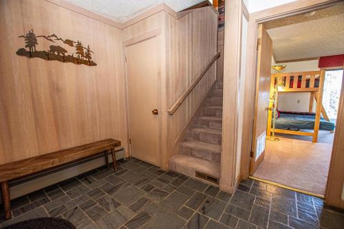 a hallway with stairs in a home with a room at Rocky Ridge # 04 By Hauserman Rentals in Tahoe City