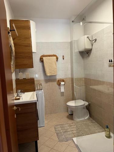 a bathroom with a toilet and a sink at way2 stay Italy in Pizzo