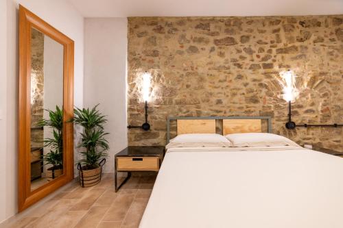 Postel nebo postele na pokoji v ubytování Rocha Suites