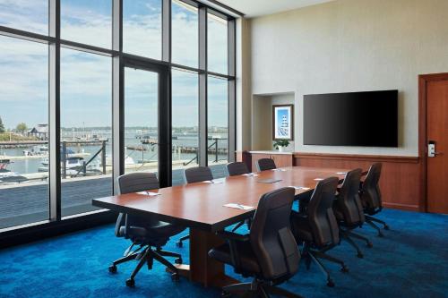 a conference room with a large table and chairs at Delta Hotels by Marriott Prince Edward in Charlottetown