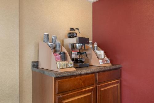 a counter with a coffee maker on top of it at Red Roof Inn Virginia Beach in Virginia Beach