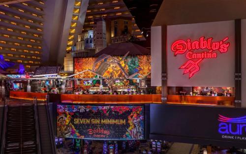 a restaurant with a bar in a city at night at Luxor in Las Vegas