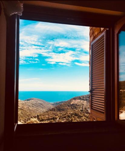 a view of the ocean from a window at Agriturismo Terra Nostra in San Mauro Cilento