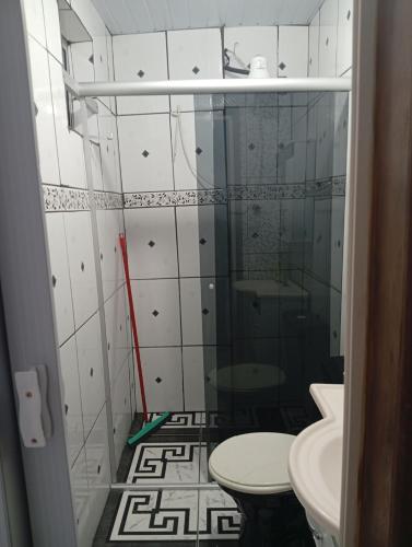 a small bathroom with a toilet and a sink at Casa aconchegante in Ouro Preto