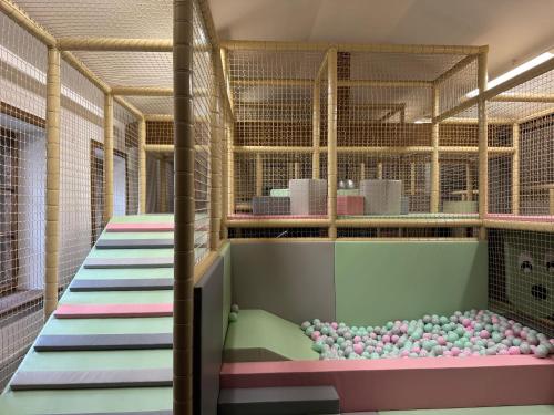 a room with a bunch of balls on the floor at Villa Vita Krupówki in Zakopane