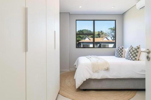 Ένα ή περισσότερα κρεβάτια σε δωμάτιο στο 18 Luxe Zimbali