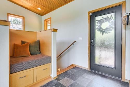 a tiny house with a bench and a window at Modern Summit Lake Escape - Spacious Deck with View! in Kamilche