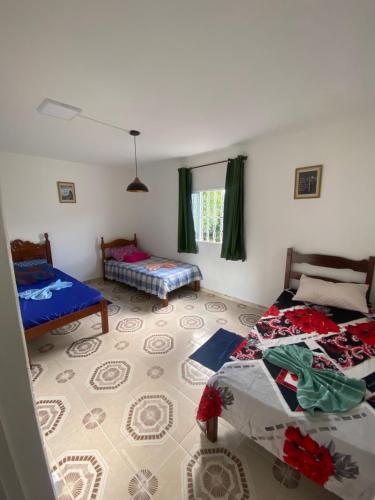Ένα ή περισσότερα κρεβάτια σε δωμάτιο στο Casa do Peregrino Pérola da mantiqueira