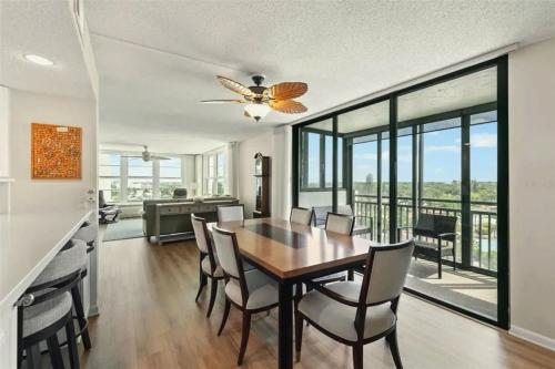 a dining room with a table and chairs at Charming Two-Bedroom Gulf-Front Condo in Venice