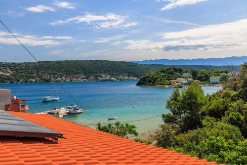 a view of a body of water from a house at Apartments Barbara in Supetarska Draga