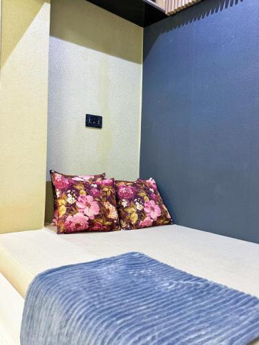 a bed with two pillows in a room at The Nook - Super Luxurious 1 Bedroom in Wuse 2 in Abuja
