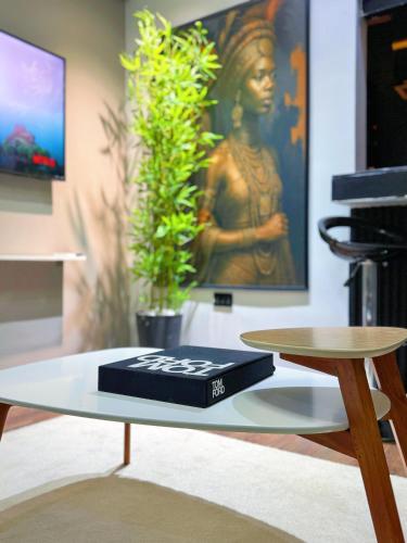 a table with a black box on top of it at The Nook - Super Luxurious 1 Bedroom in Wuse 2 in Abuja