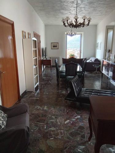a living room with a couch and a table and chairs at B&B Piazza dei Leoni in Sezze
