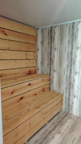 a wooden wall in a room with wooden floors at Xima Colca in Yanque