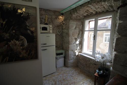 Η κουζίνα ή μικρή κουζίνα στο B&B Apartments Coli Apartman Dora Self check in