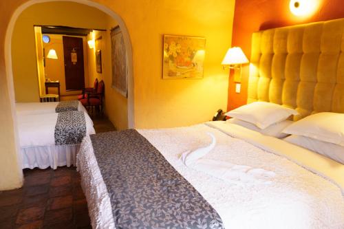 Ένα ή περισσότερα κρεβάτια σε δωμάτιο στο Hotel La Posada de San Antonio