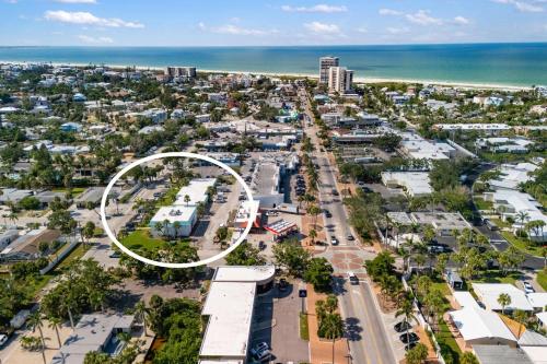 an aerial view of a city with a white circle at Heat of Siesta Village Walk to Beach w heated Pool in Siesta Key