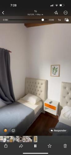 a screenshot of a room with a bed and a desk at Hospedaje L H primero B Ezeiza a 15 min del aeropuerto in La Unión
