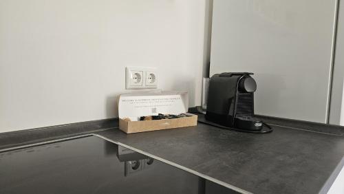 a box sitting on top of a table with a tv at Apartment Lu16 Three Bamberg - modern in zentral Lage in Bamberg