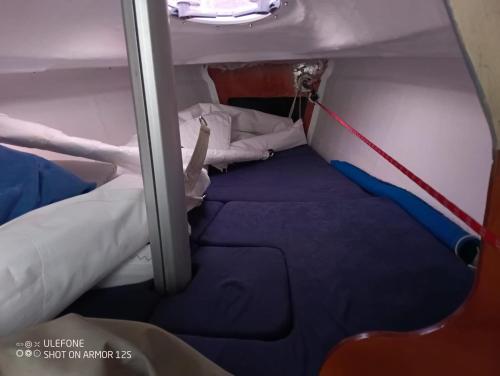 a small room with a bed on a boat at Starship JSAILING in Mošćenička Draga
