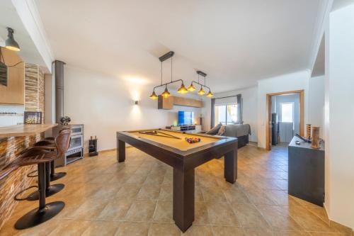 a large room with a ping pong table in it at Sagres ZEN - 3 Bedroom House in Sagres