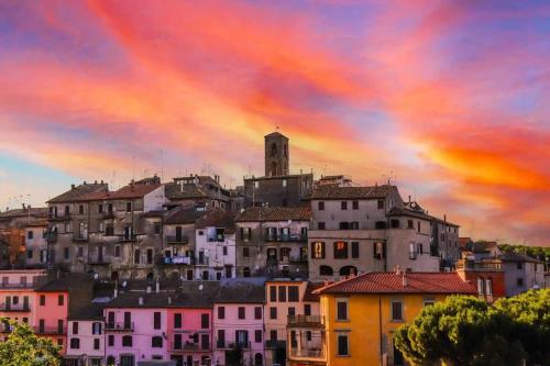 a view of a city with a rainbow in the sky at La Casita in Vallerano