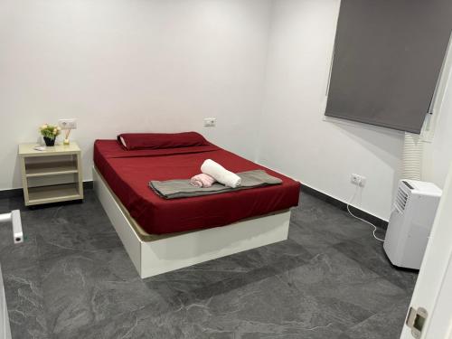 Кровать или кровати в номере FastLatin Home Sevilla