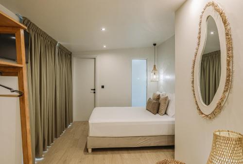 Ένα ή περισσότερα κρεβάτια σε δωμάτιο στο AMMOESSA APARTMENTS