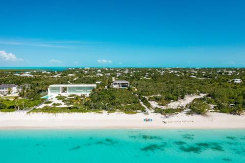 an aerial view of a resort on a beach at A magnificent villa that is perfect to enjoy a quiet vacation in Leeward