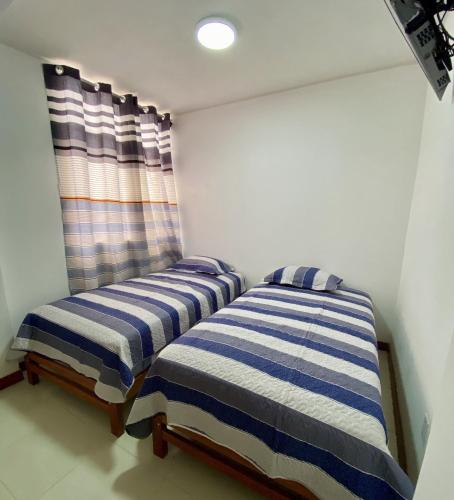 Ένα ή περισσότερα κρεβάτια σε δωμάτιο στο Hostal Venus - Nueva Imagen