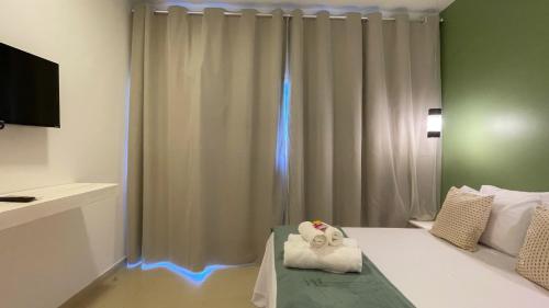 a bedroom with a bed with lights on it at Ypê Hospedagem II in Alto Paraíso de Goiás