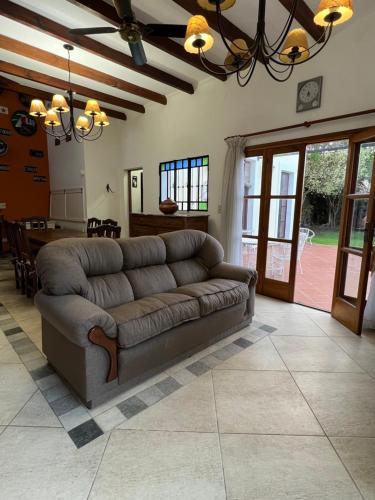 a living room with a couch and a table at Casa Rocamora - Victoria Entre Ríos in Victoria