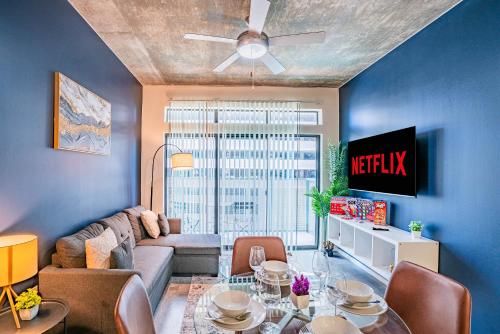 a living room with a couch and a table at Relaxing 2BD - Central Downtown - Gym, Pool, Parking in Phoenix