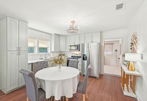 a kitchen and dining room with a table and chairs at Marietta Charmer in Marietta