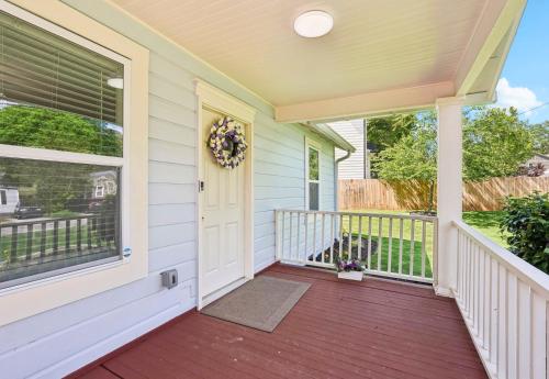 a front porch with a wreath on the door at Marietta Charmer in Marietta
