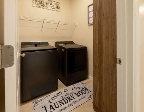 a laundry room with a washer and dryer at Serenity Escape in Palm Coast