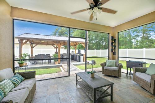 a living room with a couch and chairs at Serenity Escape in Palm Coast