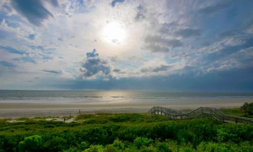 a view of a beach with the sun and the ocean at Serenity Escape in Palm Coast