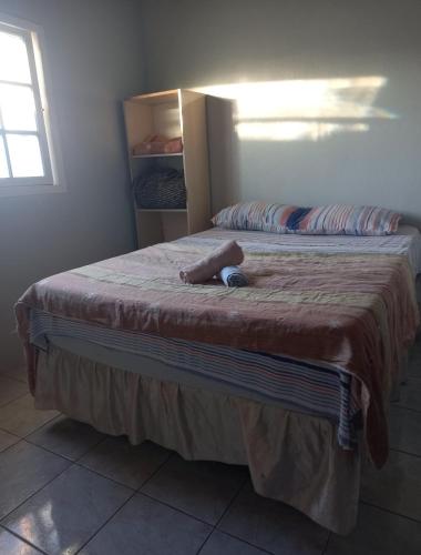 Una cama o camas en una habitación de Hostchê compartilhados
