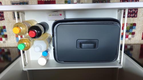 an open refrigerator door with bottles on a shelf at 22minutes by car to Nagoya Station 2parking 