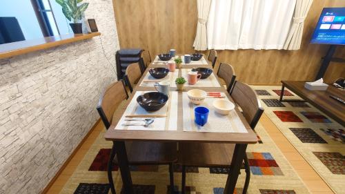 a dining room with a table and chairs at 22minutes by car to Nagoya Station 2parking 