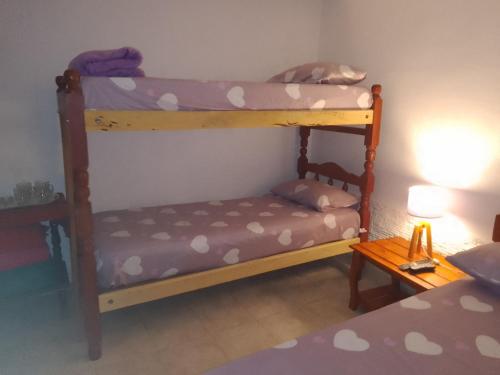 a couple of bunk beds in a room at Hostel Trinidad in San Salvador de Jujuy