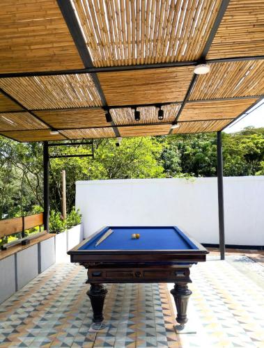 a pool table on a patio with a wooden ceiling at Finca Villa Tere in Fusagasuga