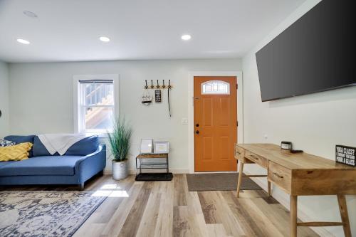 a living room with a blue couch and a wooden table at 2 Bedroom Condo in Tannersville - 6 Minutes from Camelback Mountain in Tannersville