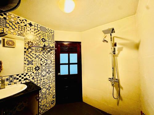 a bathroom with a sink and a toilet and a shower at Hanoi ILDIVO 8 Hang Dao in Hanoi
