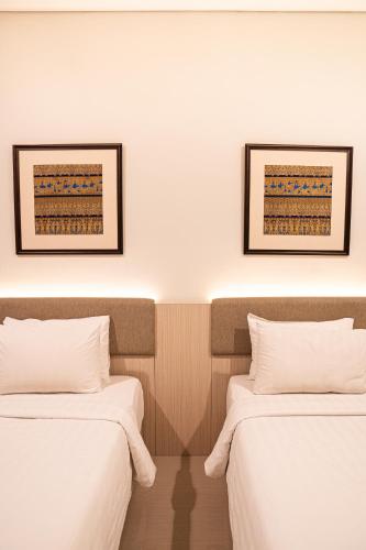 Ένα ή περισσότερα κρεβάτια σε δωμάτιο στο Skysuites Residence