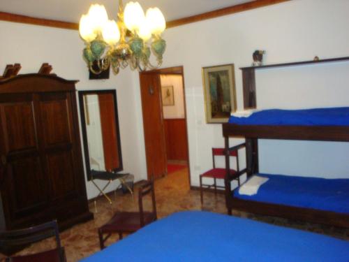 a room with two bunk beds and a mirror at B&B Villa Tina in Alfedena